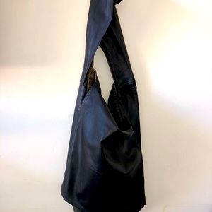 This is a chic Rundholz black shoulder bag perfect to dress up or down.